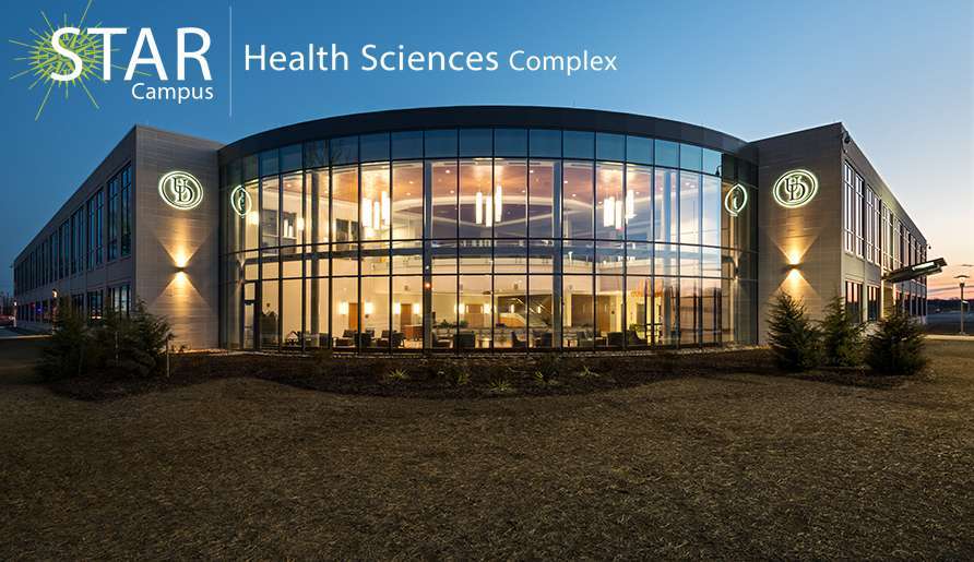 a photo of the Health Sciences Complex (HSC) at dusk on the Science, Technology, and Advanced Research (STAR) campus.