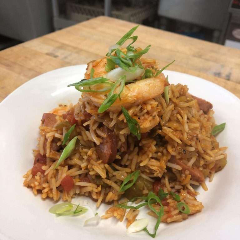 A rice dish on a white plate