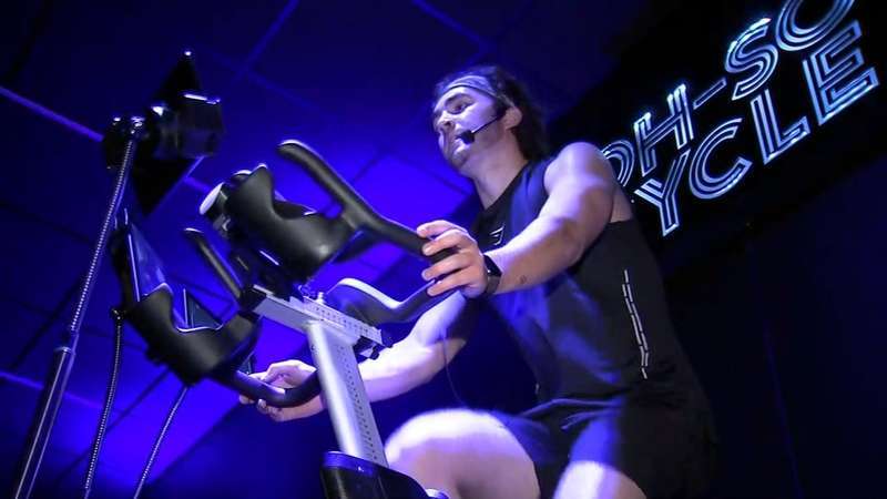 A man working out on a cycling machine