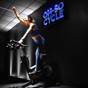 A woman working out on a cycling machine