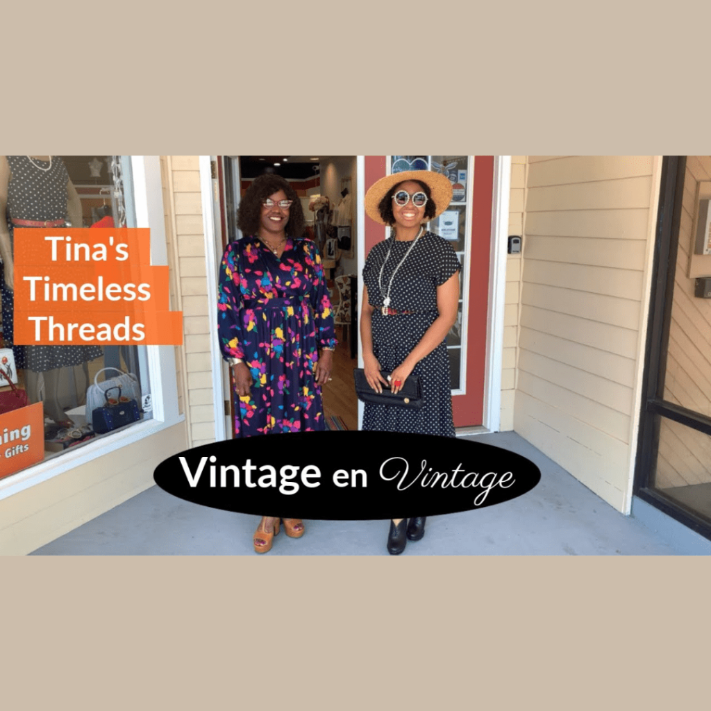 Two women standing in front of a vintage clothing shop