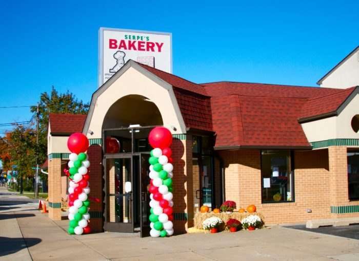 A building with Serpe's Bakery sign and balloons at the entrance