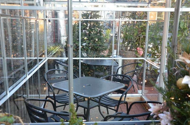 A dining area made up of a black table and four black chairs