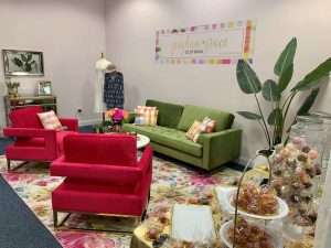 A setup of a red and green couch