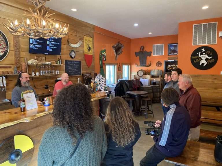 A group of people lounging at a pub