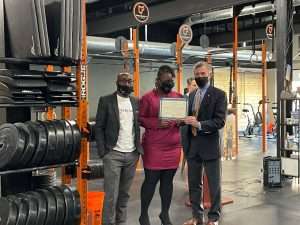 Founders of One Way Insurance receiving an award at the EDGE grant event
