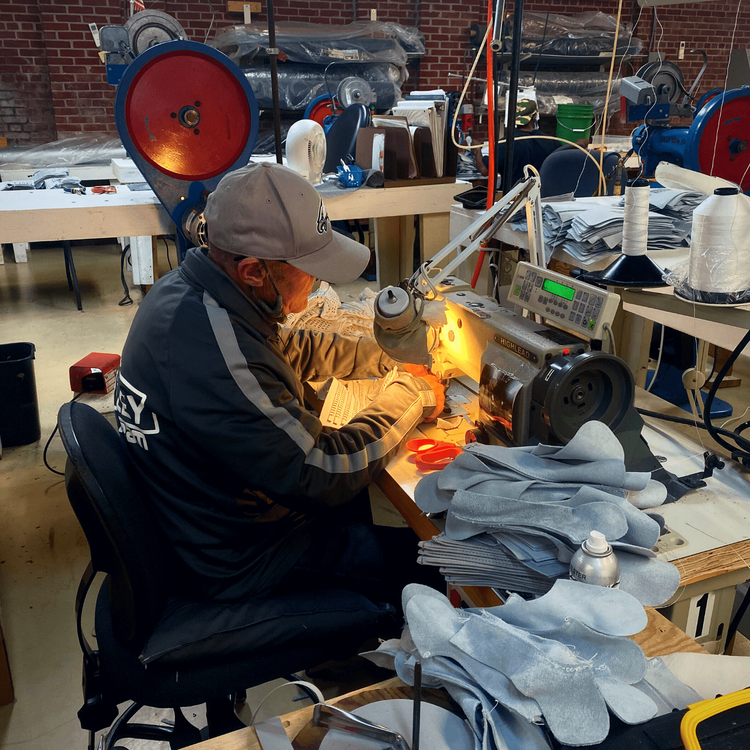 A volunteer working with a sewing machine