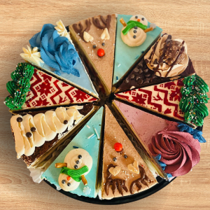 Different slides of cake on a plate.