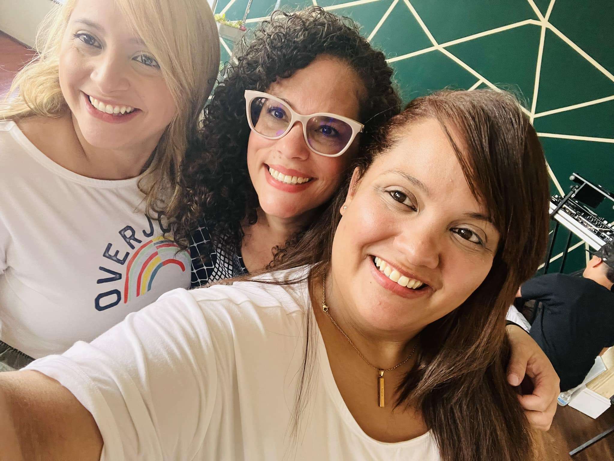 Three women smiling in a selfie picture