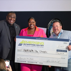 Delaware SBDC client Droneversity receiving an award.
