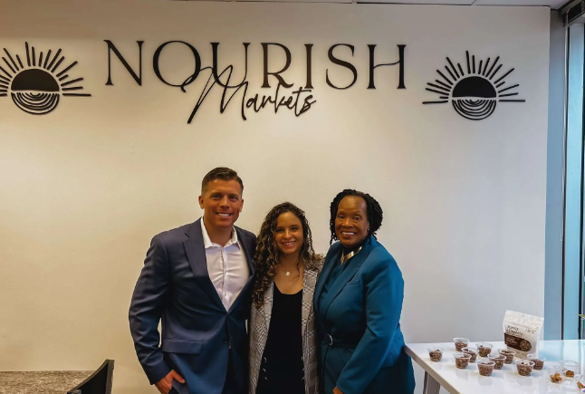 Delaware SBDC Client Nourish Markets with SBDC advisor at the grand opening.