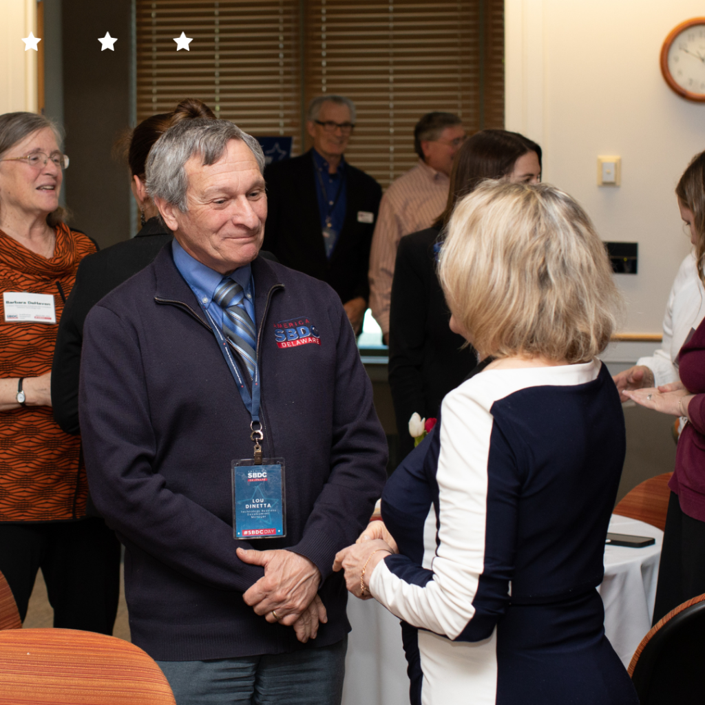 Delaware SBDC advisor speaker with a lady at an event