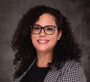 A professional headshot of a Delaware business advisor in business attire.