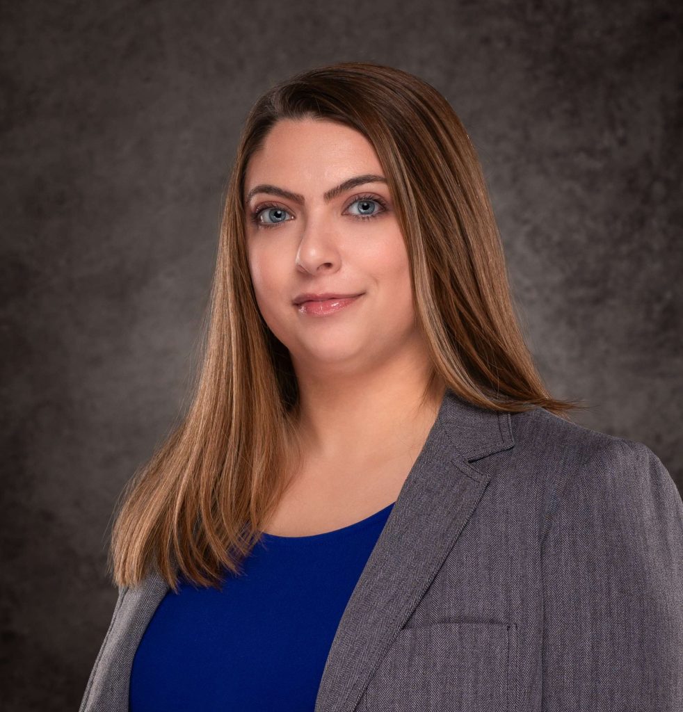 A professional headshot of a Delaware business advisor in business attire.