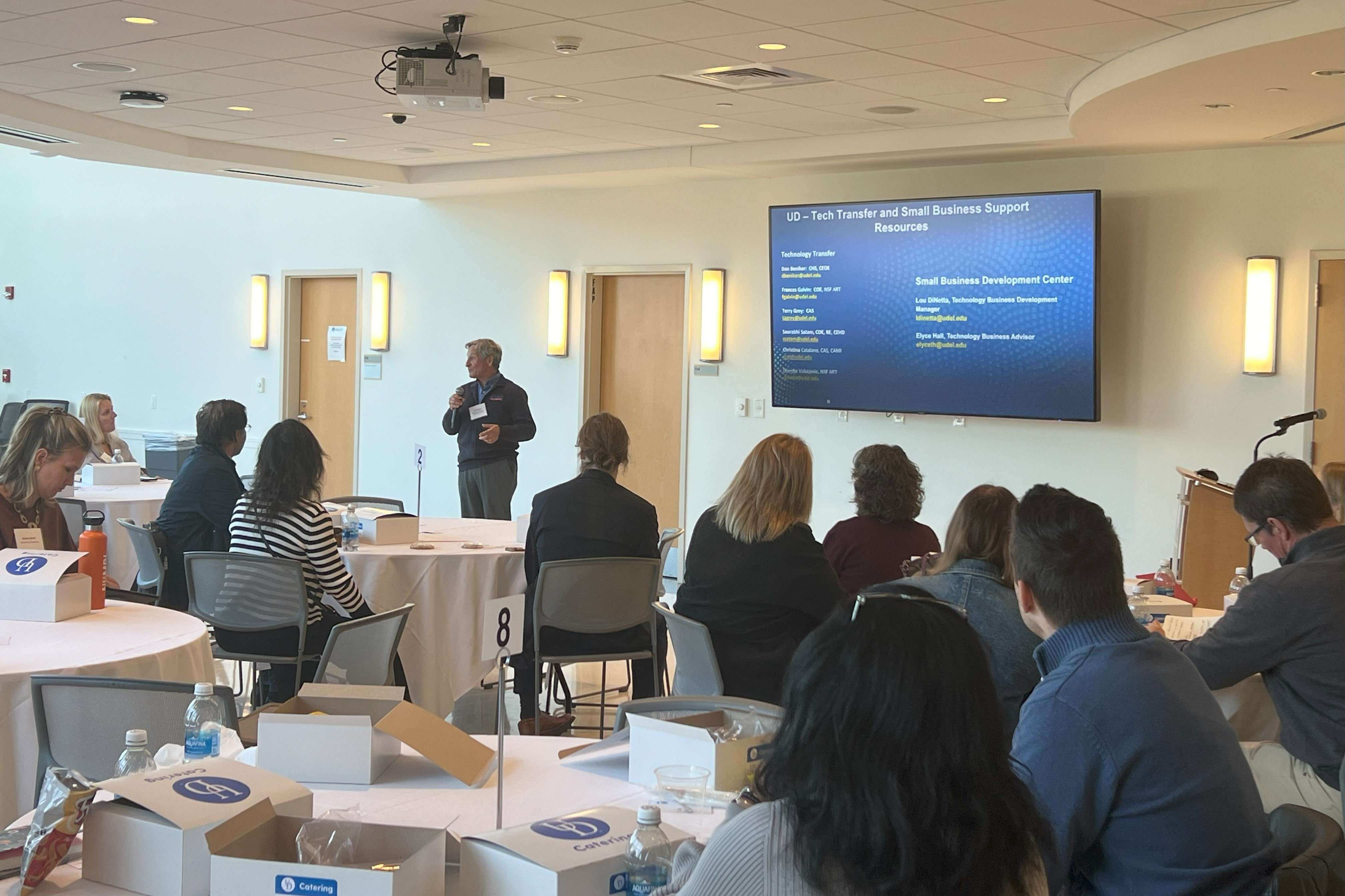 A group of professionals listening to a presentation