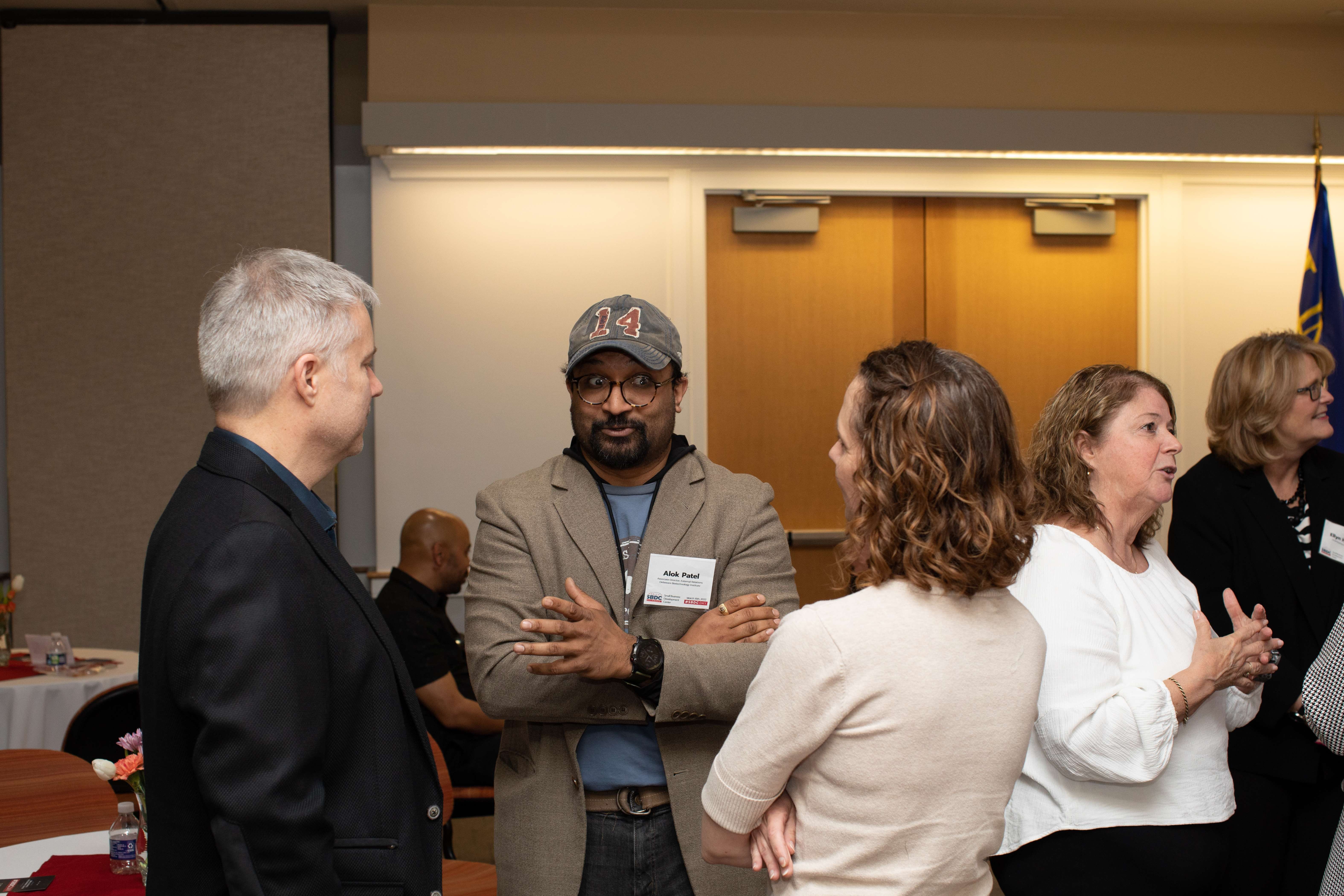 A group of people in professional attire networking