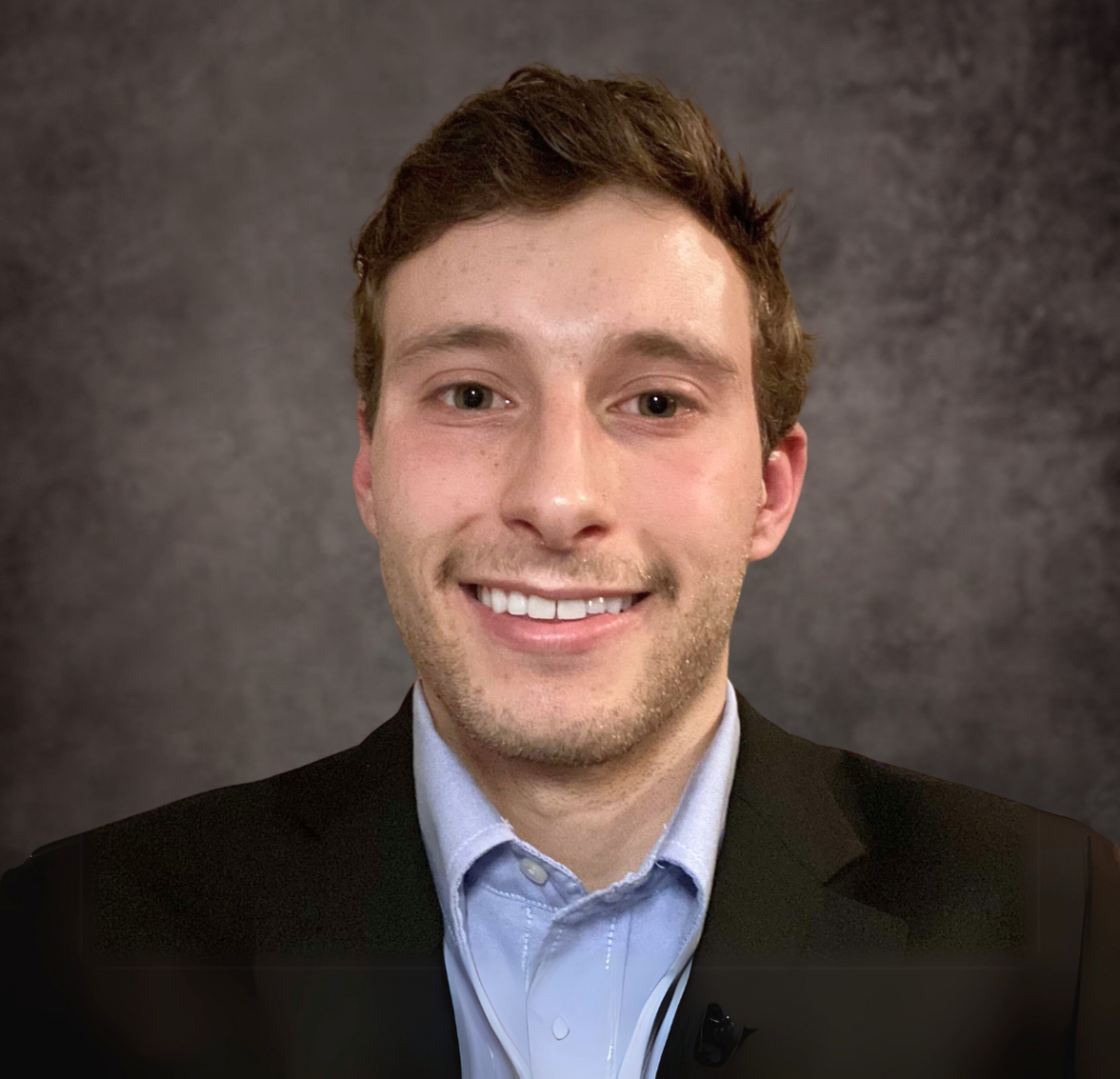 A professional headshot of a Delaware business advisor in business attire.
