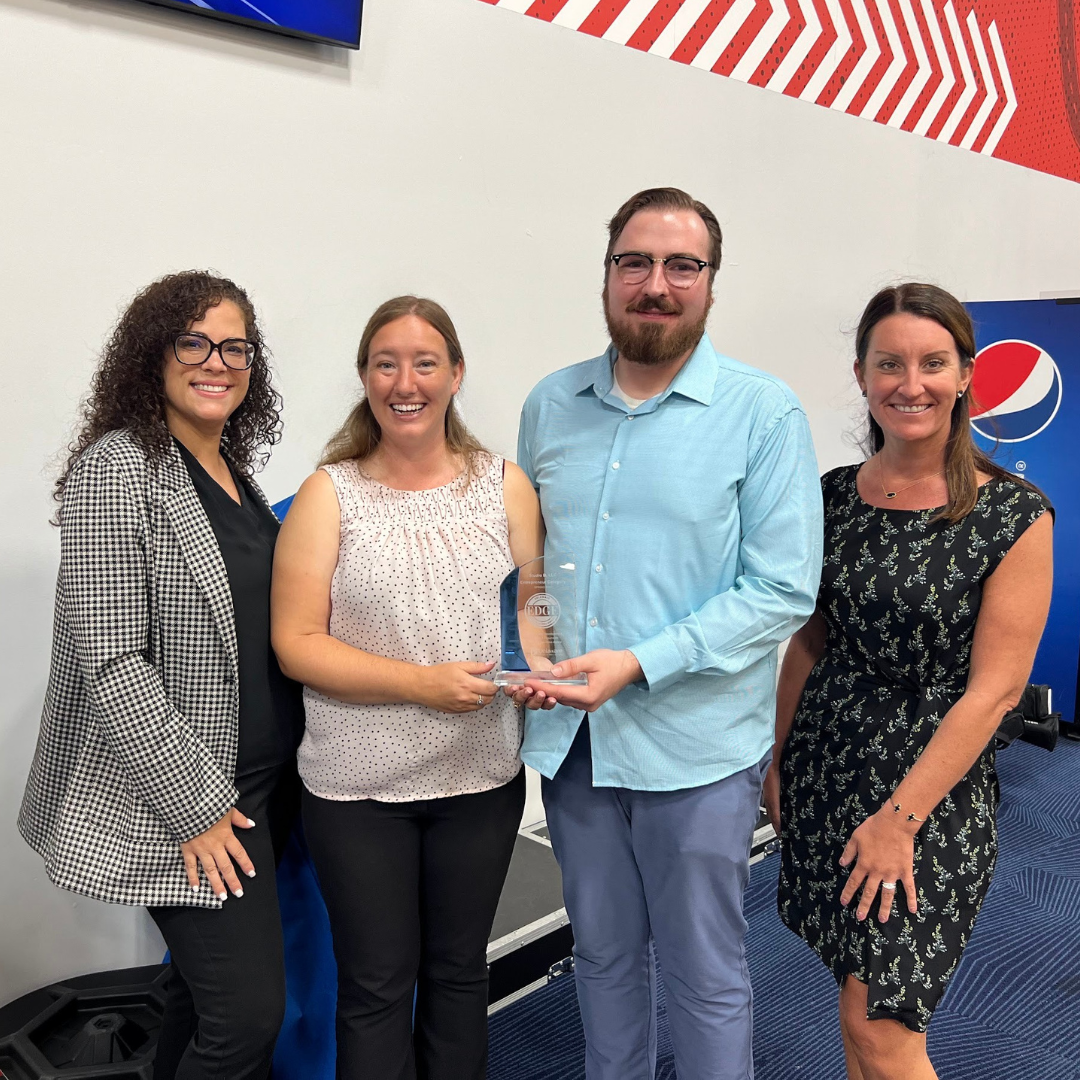 Delaware business advisor standing with the winners of the EDGE grant