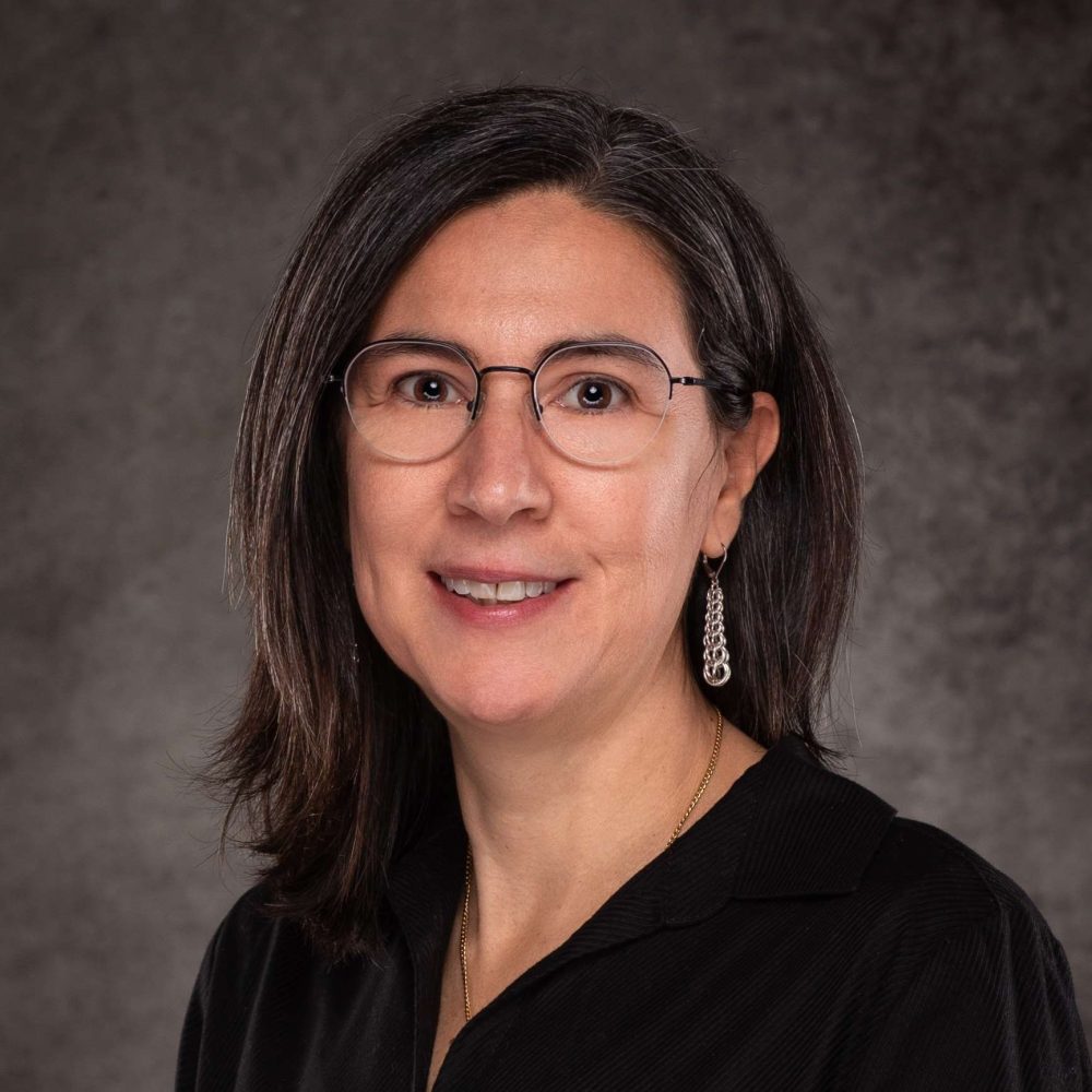 A professional headshot of a Delaware business advisor in business attire.