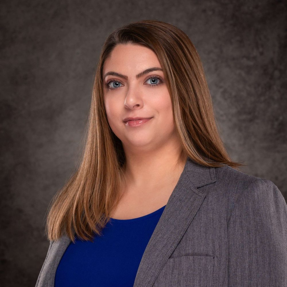 A professional headshot of a Delaware business advisor in business attire.