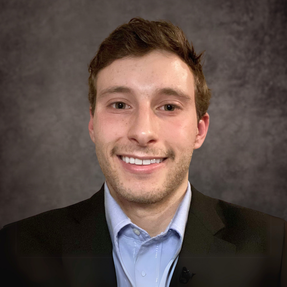 A professional headshot of a Delaware business advisor in business attire.